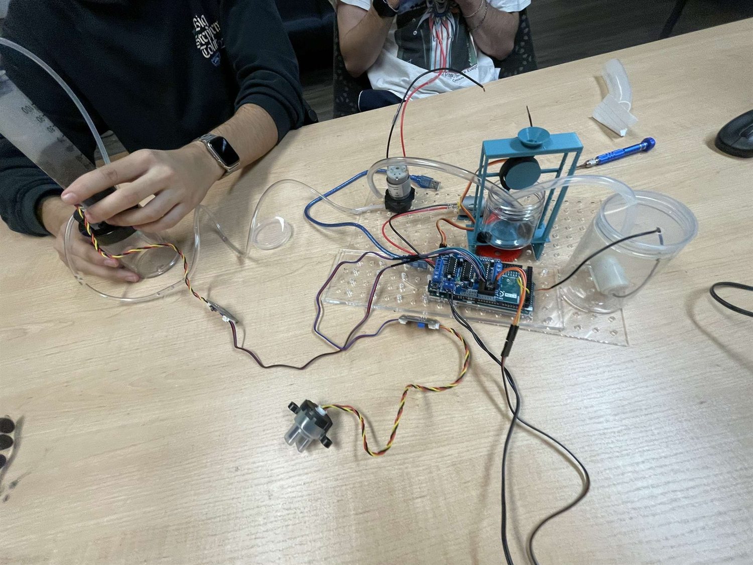 The wider bench setup with pumps, tubing and the control board